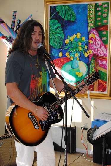 Singer performing at Grace Cafe and Gallery